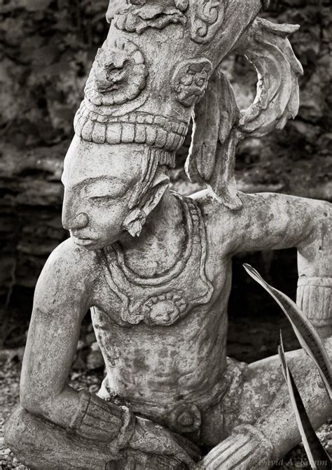 Statue Of An Ancient Mayan Warrior In A Jungle Setting In Mexicos