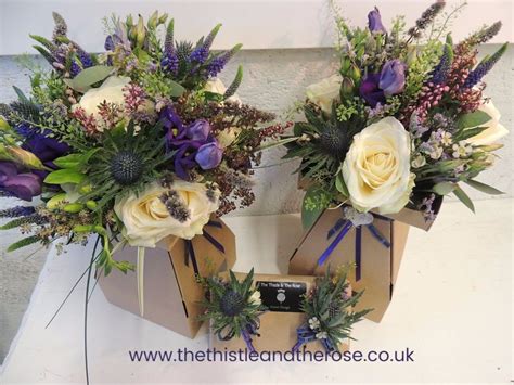 scottish themed bridal and bridesmaids bouquets in cream purple and lilac with thistle
