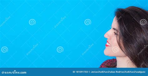 Young Smiling Woman Profile Side View Face Isolated On Blue Background