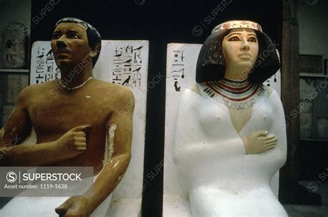 close up of two statues in a museum prince rahotep princess nofret egyptian museum cairo