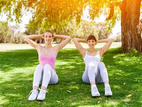 Young Women Exercising In The Park Stock Photo Image Of Athletic