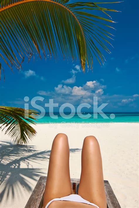 Woman At Beach Lying On Chaise Lounge Stock Photo Royalty Free