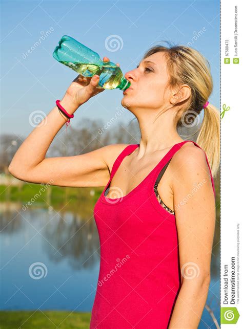A Woman Drinking Water From Bottle After Fitness Sport Exercise Stock