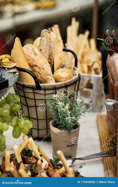 A Basket With Fresh Bread On A Buffet Table Stock Photo Image Of