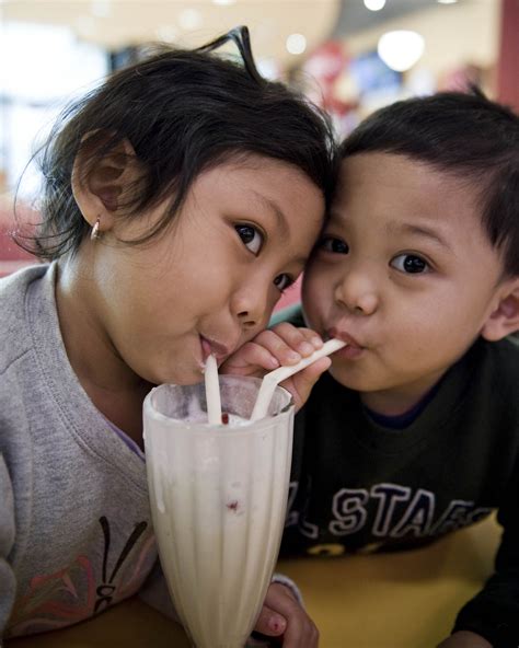Filechildren Sharing A Milkshake