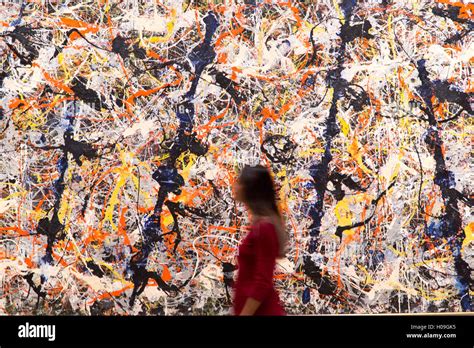 A Woman Walks Past Blue Poles 1952 By Jackson Pollock During A