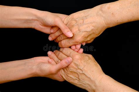 Old Woman And Young Woman Holding Hands Together Stock Image Image Of