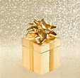 Premium Photo | Golden gift with ribbon over shiny background