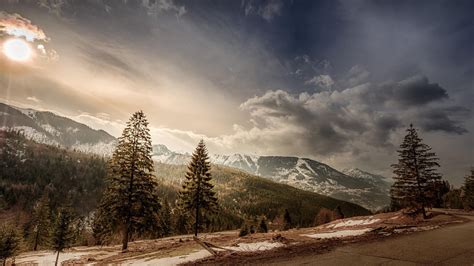 Romania Trees Mountains Snow Sun Clouds Road Wallpaper Nature