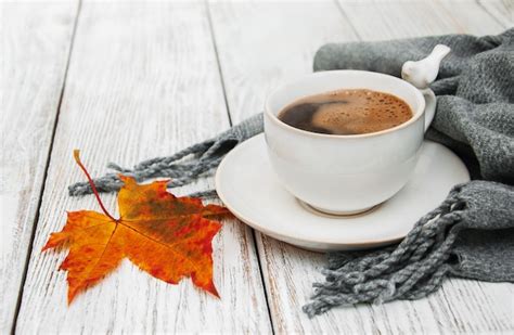 Premium Photo Cup Of Coffee And Autumn Leaves