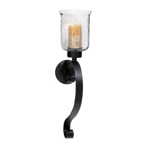 Brilliant designers can create wrought iron pieces to match any theme. LITTON LANE 27 in. Wrought Iron Candle Sconce with Glass ...