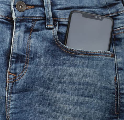 Mobile Phone With Blank Mockup Screen In The Pocket Of Blue Jeans Stock