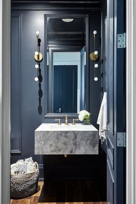 Black Paneled Powder Room With Marble Floating Sink Vanity