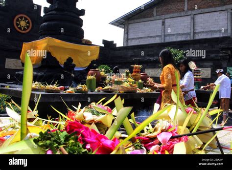 Javanese Balinese Hindus Put Offerings During The Celebration Of The