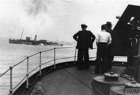 A Paddle Steamer Seen From The Deck Of Another Vessel Reaches Safety