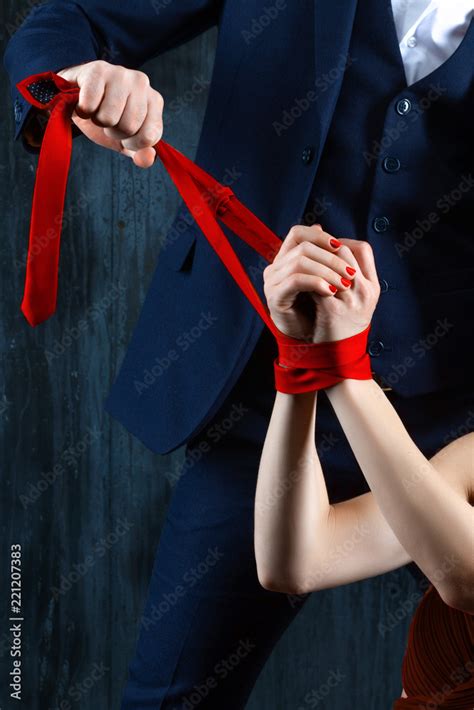 Couple In Dating Body Rich Man Male Tying Woman Hands Woman Female In Expensive Red Evening