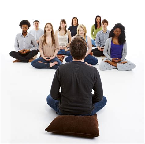 Meditation Teacher Meditating With A Group Of People The Science Of