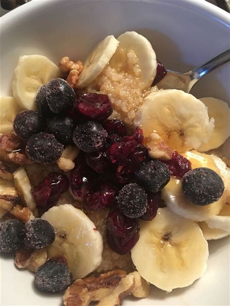 Cooked Quinoa Breakfast Cereal Topped With Bananas Blueberries