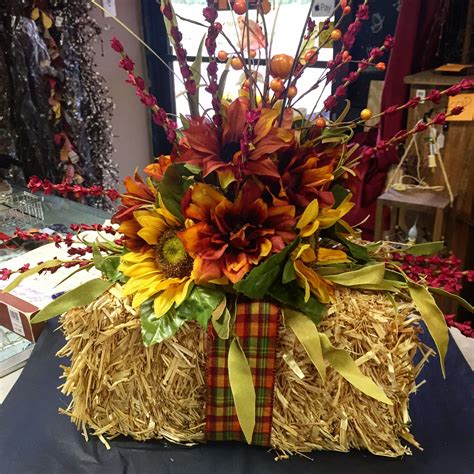 A wide variety of hay decoration options are available to you, such as material, certification, and metal type. Hay bale Centerpiece | Fall flower arrangements, Western ...