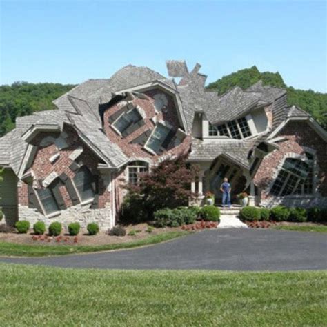 Unique And Futuristic Brick House With Two Story Windows