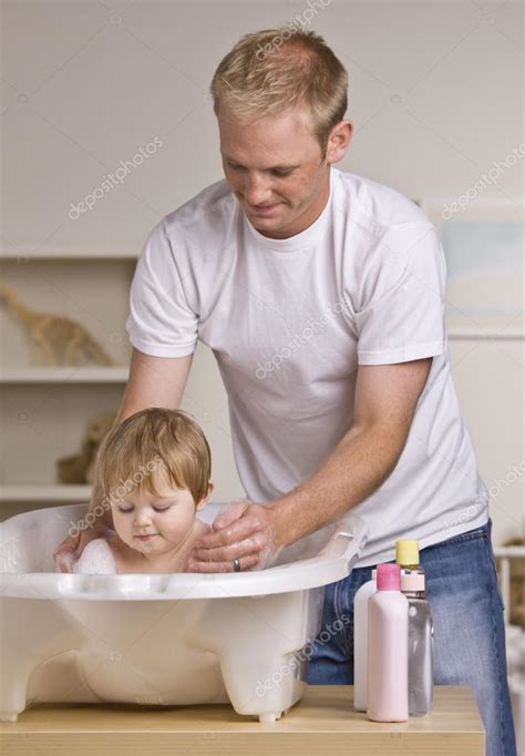 Father Giving Daughter Bath Stock Photo By ©spaces 18778769