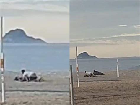 vídeo deitadinha esperando rola casal transa na praia enquanto morador de rua assiste tudo