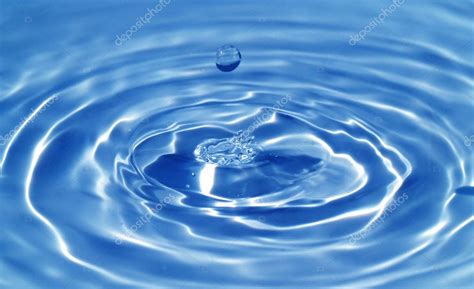 Macro Of A Water Droplet And Ripples Stock Photo By ©frankljunior 2376116