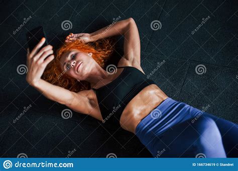 Taking A Selfie With Phone Sporty Redhead Girl Have Fitness Day In Gym
