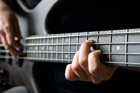 Bass Guitar Player Hand Closeup Lesson And Practice Theme Playing On