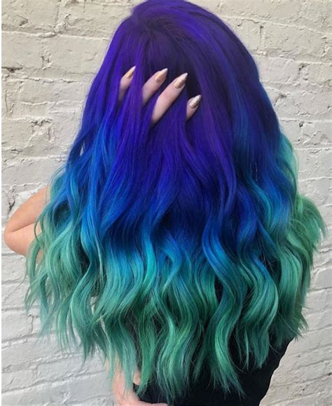 white brick wall what is ombre hair purple to blue and green black top long wavy hair