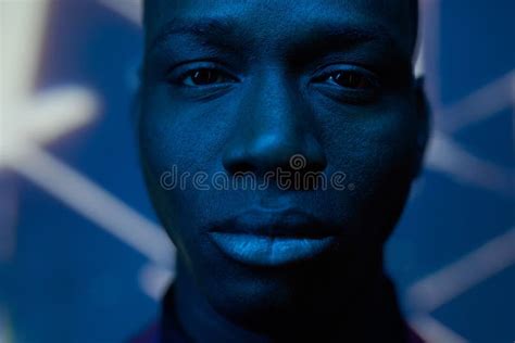 Close Up Of Face Of Serious Black Man Standing In Front Of Camera Stock