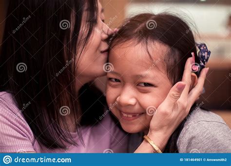 Asian Daughter Smiling With Her Mother Kissing Stock Image Image Of Lifestyle Health 181464901