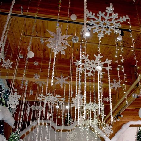 Snowflakes And Twinkling Lights Hang From The Ceiling Above Bronners