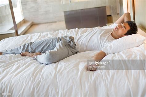 Young Man Sleeping On Bed ストックフォト Getty Images