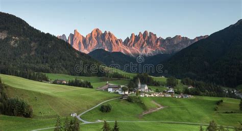 Small Italian Mountain Town Of St Magdalena In Val Di Funes At Sunset