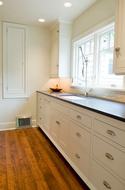 Cream painted inset cabinets with a beaded face frame create a traditional, classic look in this south. Painted Flush inset Kitchen Cabinets - Traditional - Kitchen - seattle - by Beech Tree Woodworks