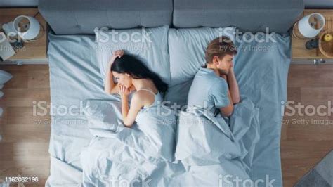 Quarrelling Young Couple In The Bed Young People Lying Turned Away From