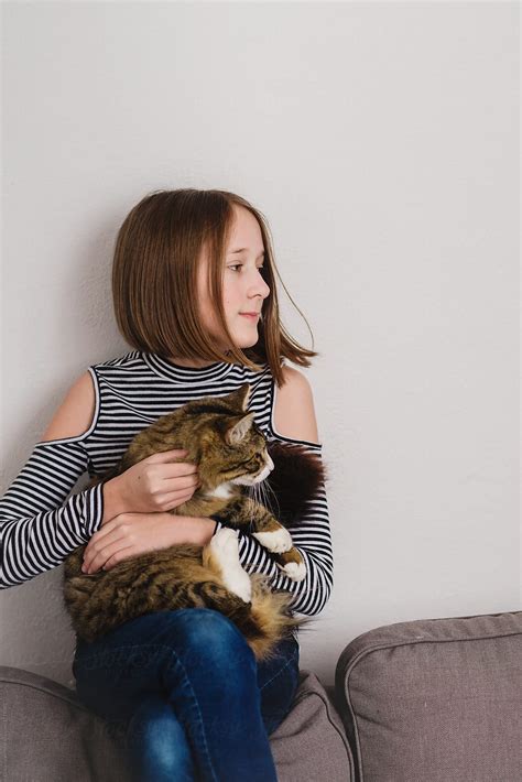 Tween Girl Holding Her Cat By Stocksy Contributor Gillian Vann