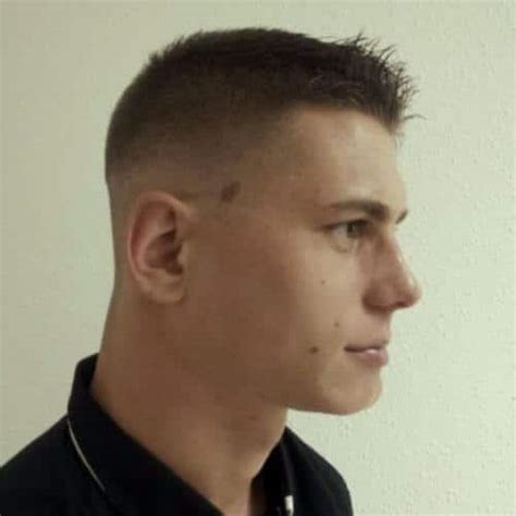 Man with low taper fade on curly hair credit: 50 Buzz Cuts for Men that Are Easy & Cool to Style | Men ...