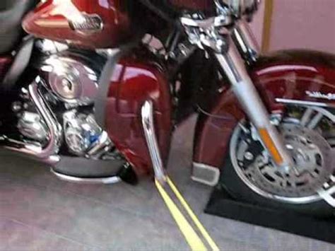 It allows one person to steady the bike and one person to tie it down. Tie down Triglide - YouTube