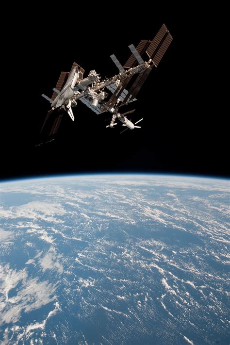 The International Space Station And The Docked Space Shuttle Endeavour Cosmos Space Nasa Space