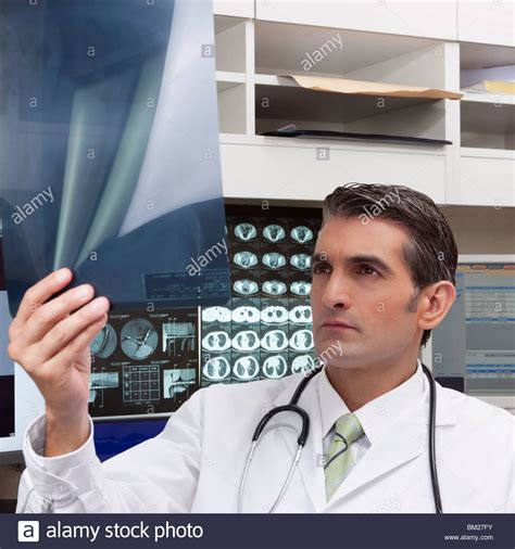 Doctor Examining An X Ray Report Stock Photo Alamy