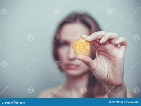 Woman Holds A Golden Bitcoin Coin In Her Hand Business Processes