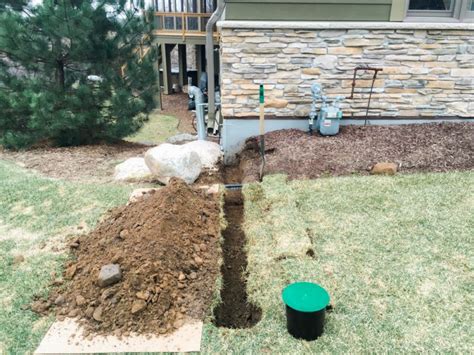 Underground Downspout Diverter Extension Keeps Roof Water Away From