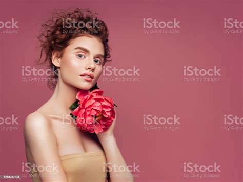 Beautiful Woman With Big Flower Natural Soft Makeup Stock Photo