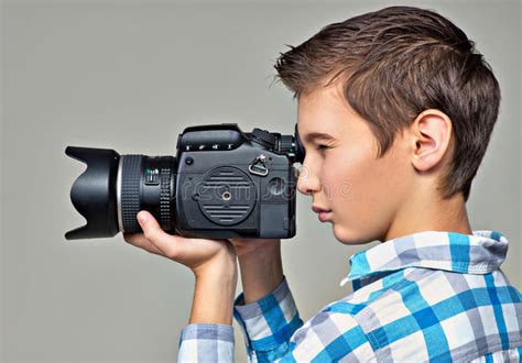 Boy With Camera Taking Pictures Stock Photo Image Of Medium Studio