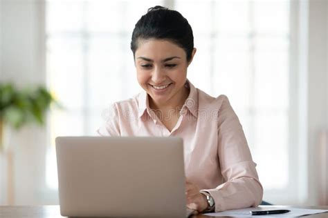 Smiling Indian Female Employee Work At Laptop Stock Photo Image Of