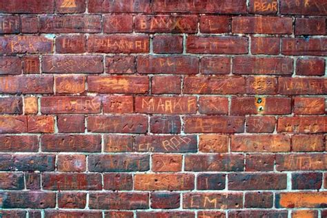 Graffiti Filled Red Brick Wall — Stock Photo © Meteor 2322896