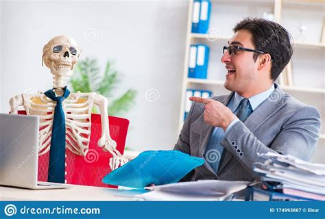 Businessman Working With Skeleton In Office Stock Image Image Of