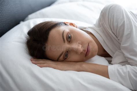 Closeup Melancholic 30s Woman Awakened Lying In Bed Feels Depressed